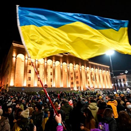 Demonstrators wave the Ukrainian flag during a rally in support of Ukraine in Tbilisi, Georgia