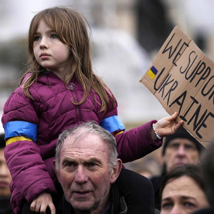 A girl holds a placard during a protest against the Russian invasion of Ukraine, in Trafalgar Square, London