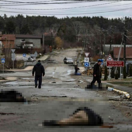 Bodies pictured on a street in Bucha, as the UK investigates war crimes