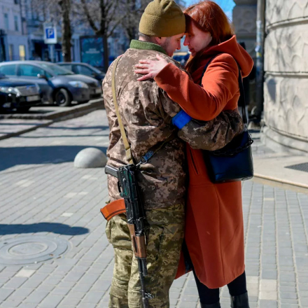 Igor, a 40-year-old Ukrainian soldier, embraces his wife in Odessa