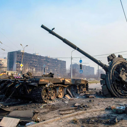 A destroyed tank likely belonging to Russia / pro-Russian forces lies amidst rubble in the north of the ruined city