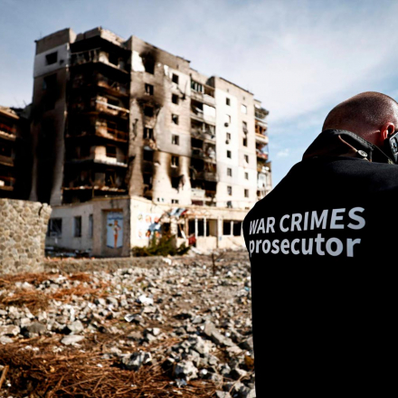 A war crimes prosecutor team inspects buildings that were destroyed by Russian shelling in Borodyanka